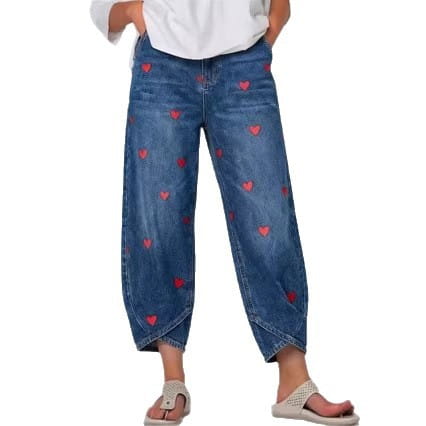 Blue denim jeans for women featuring red heart embroidery on the front.