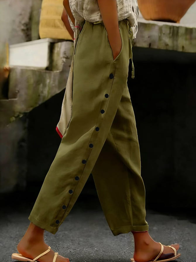 Olive green cotton cropped patchwork button casual pants for women featuring black button detailing along the side seam.