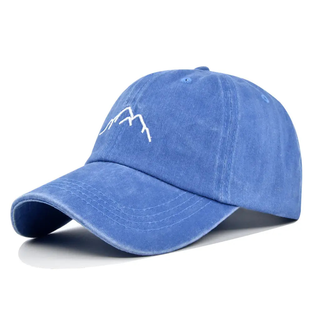 Blue denim-style embroidered mountain baseball cap featuring a white mountain design on the front.