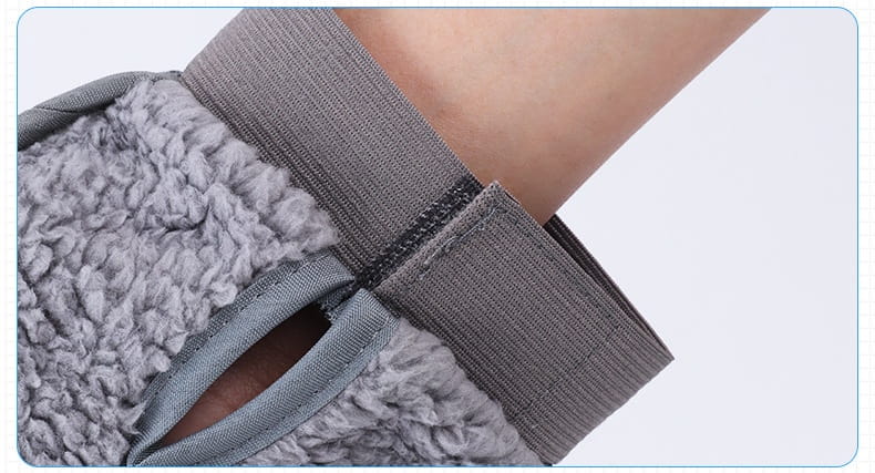 Gray fuzzy knee pad with elastic strap and stitched seams for comfort and secure fit in pet grooming glove silicone hair remover bath brush product.