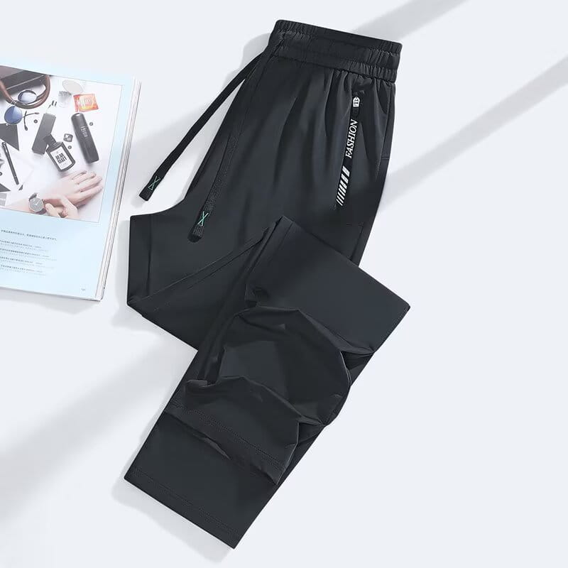 Black anti-mosquito casual athletic trousers with a drawstring waistband and side pockets featuring white fashion branding.