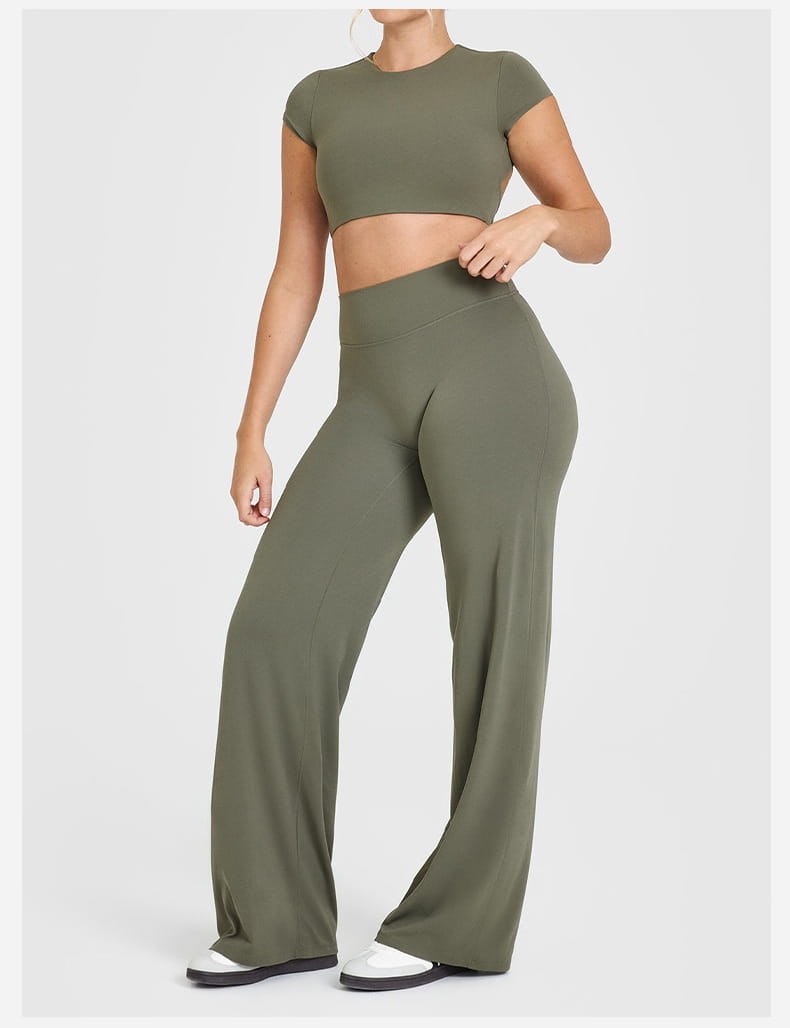 Olive green slimming yoga pants with high waisted straight leg design made of seamless stretchy fabric.