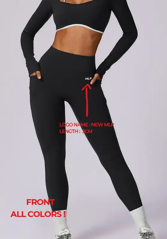 Black high waisted athletic leggings with a white logo on the thigh and long sleeves designed for athletic use.