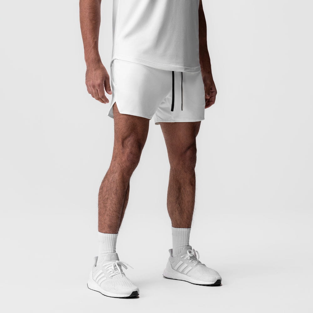 men quick dry athletic sports shorts in white featuring a black drawstring and side slit detail for enhanced comfort and performance