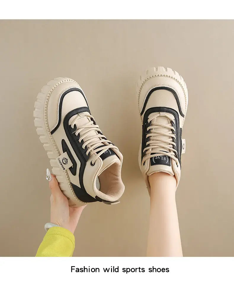 Cream-colored women’s chunky platform breathable high top sneakers with ridged sole and beige suede accents.