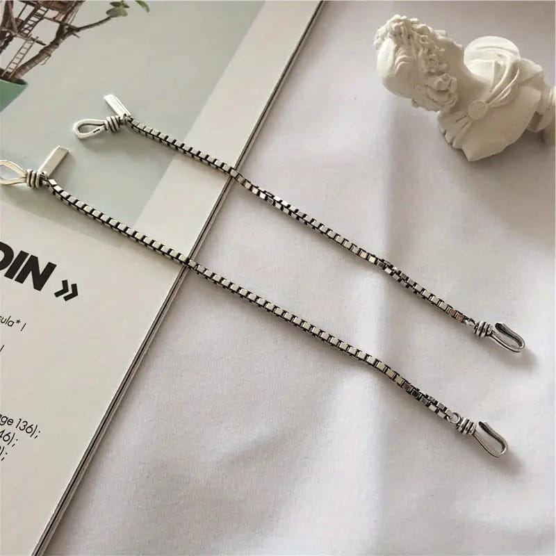 vintage silver box chain cross bracelet featuring a silver chain with interlocking square links and matching hooks at each end.