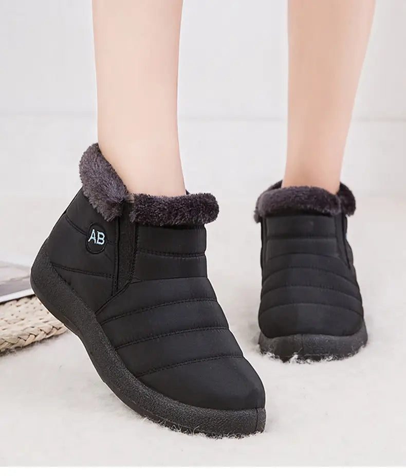 Bottines d’hiver imperméables matelassées noires, avec doublure intérieure moelleuse en fausse fourrure grise et semelle en caoutchouc pour protéger la cheville et apporter de la chaleur.