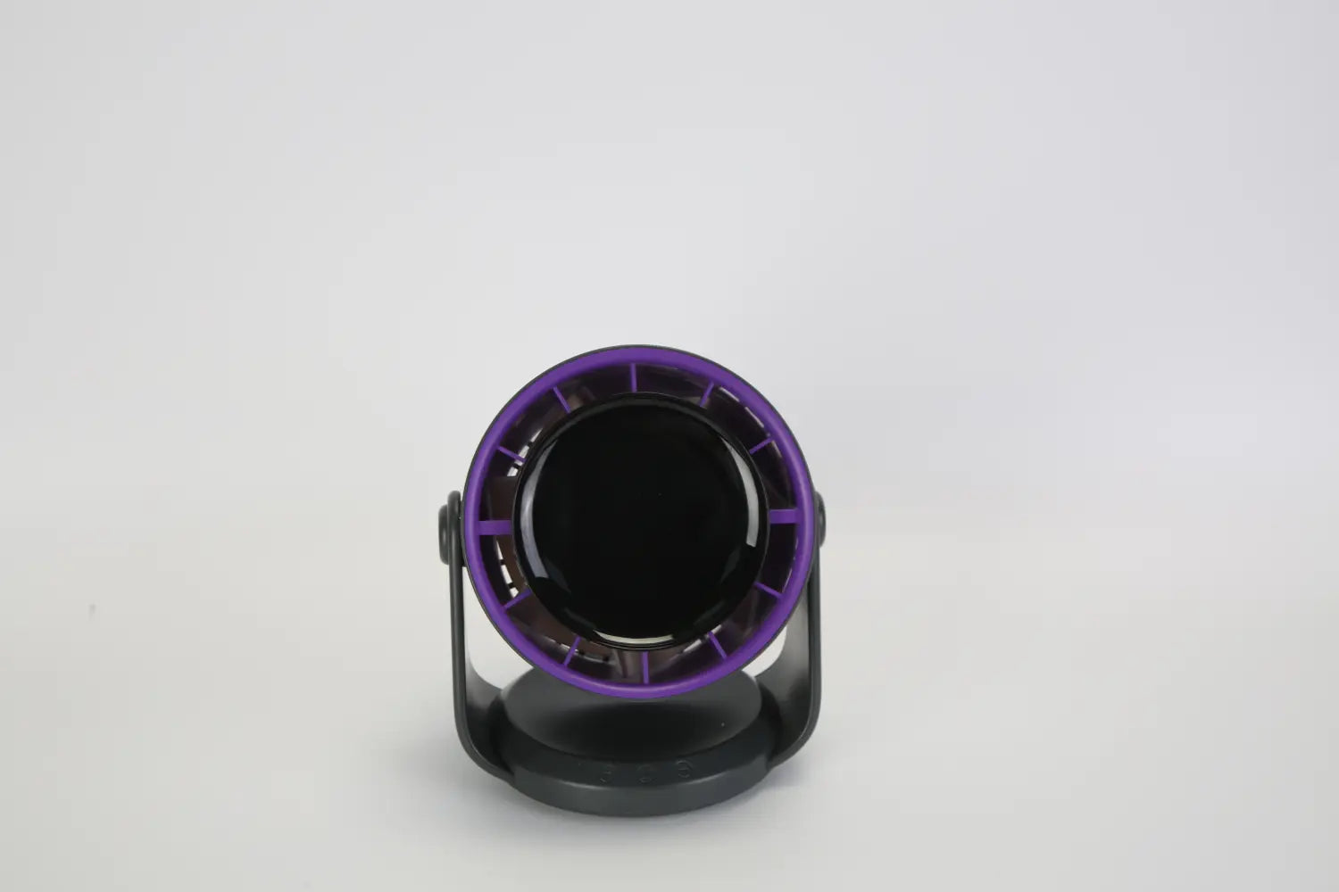Purple and black circular desk lamp with a sleek modern design featured alongside a 100 speed rechargeable desk fan with 120 degree tilt and 4000mAh battery.