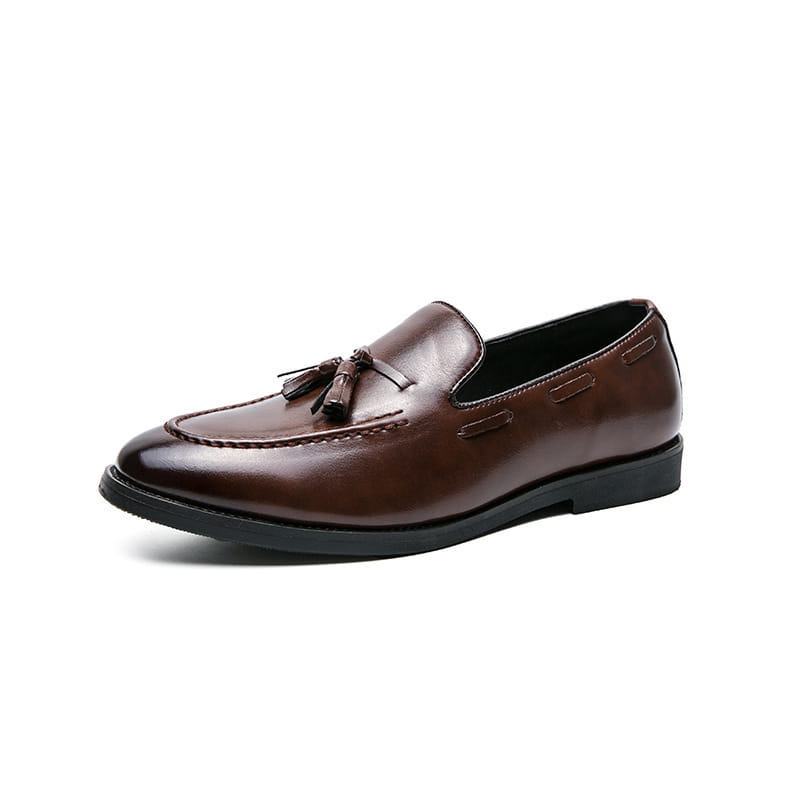 brown leather tassel loafers with polished finish and black rubber sole designed as slip on shoes