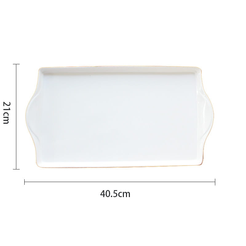 White rectangular ceramic serving tray with gently curved handle-like sides and delicate gold rim from ceramic tea set with plaid teapot and gold trim tray.