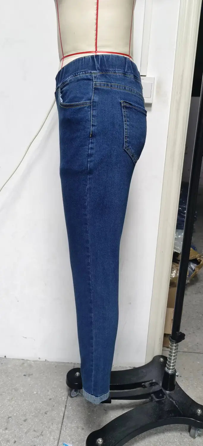 high waist slim denim leggings in dark blue denim with a slim fit and rolled cuffs.