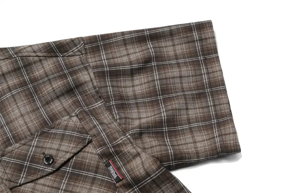 Brown and white plaid embroidered short sleeve flannel shirt with subtle texture.