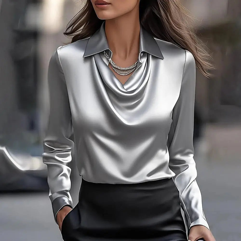 A sleek silver satin blouse for women featuring a cowl neckline and long sleeves perfect for elegant occasions.