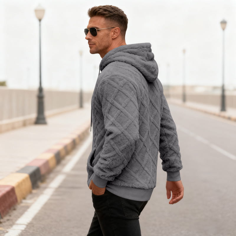 Men’s gray quilted fleece lined knit hoodie with a soft textured surface and ribbed cuffs.