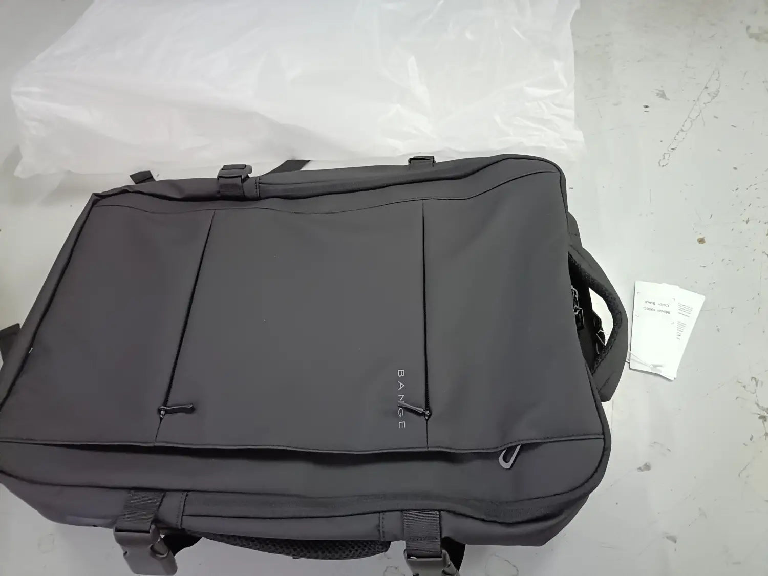 Black fabric Bange 16 inch waterproof laptop travel backpack with subtle bane branding on the front.