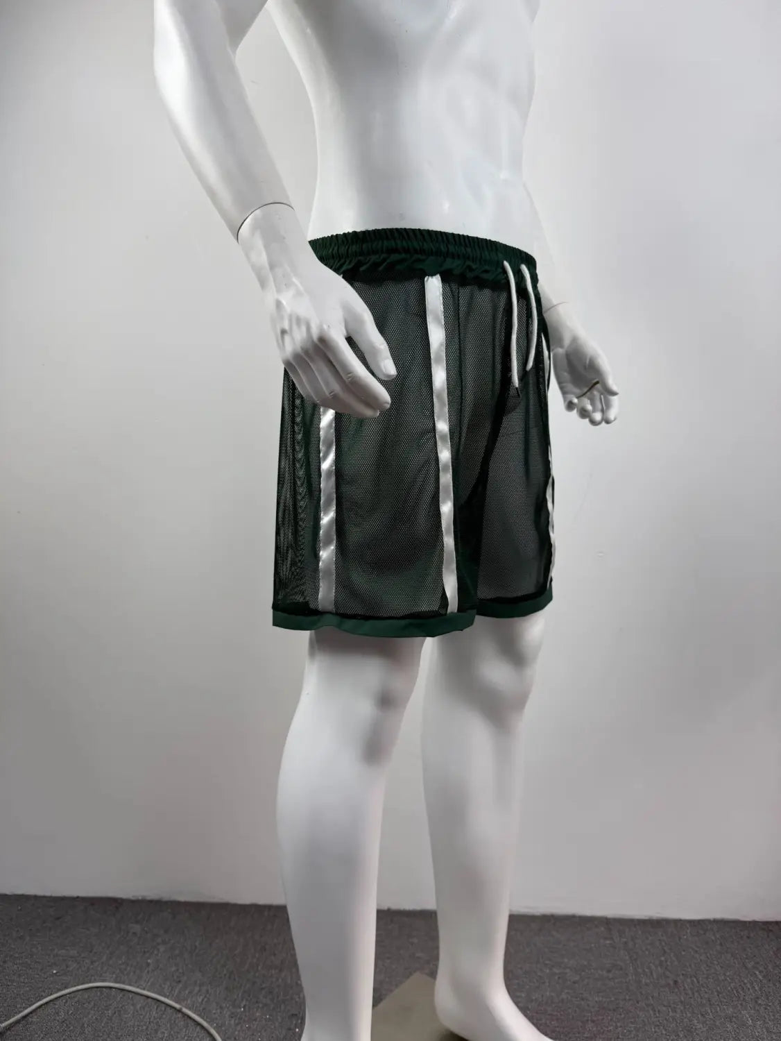 Men quick dry white mesh athletic shorts with dark green fabric mesh panels, silver reflective stripes down the sides, and a drawstring waistband.