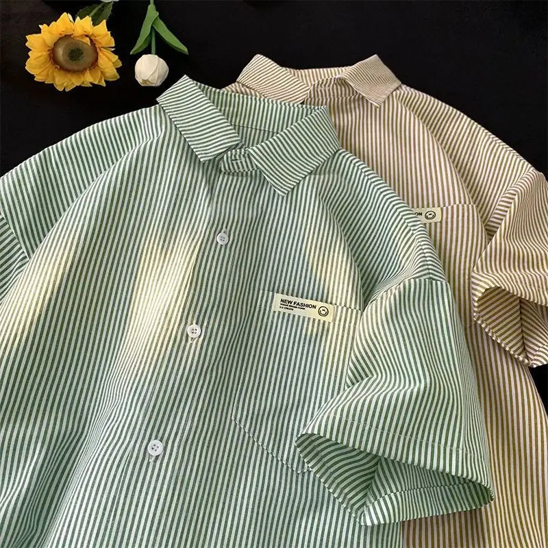 Plus size casual shirt featuring green and white vertically striped short sleeves with a collar and a small new fashion label on the chest pocket.