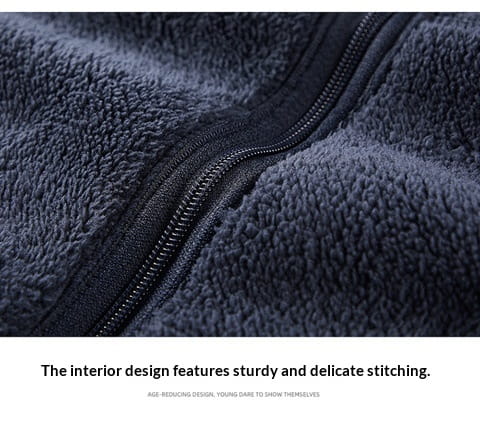 Mens fleece casual multipocket winter jacket in dark navy with a black zipper and plush textured interior made of fleece for warmth and comfort.