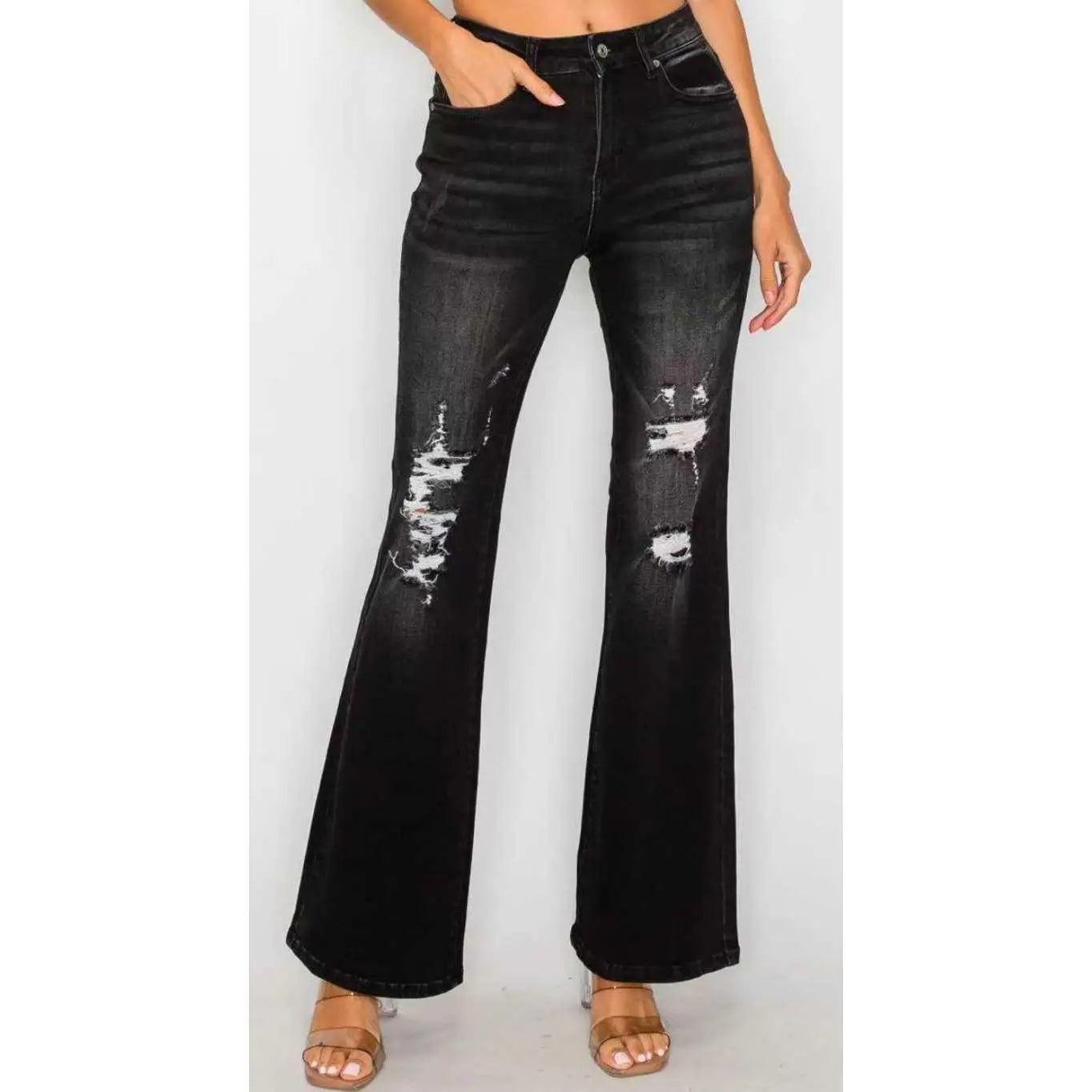 Black low rise ripped flare jeans made of distressed denim with black color and ripped knee details.