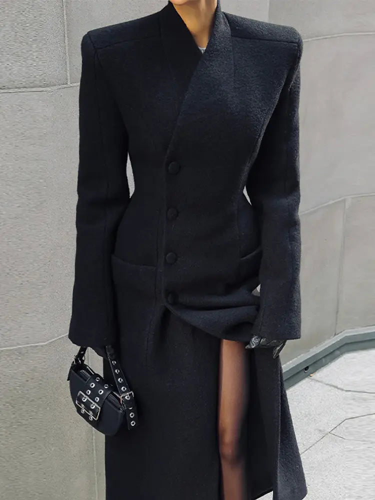 Charcoal gray wool coat for women featuring a black structured design with exaggerated shoulders and a high collar for waisted long outerwear.