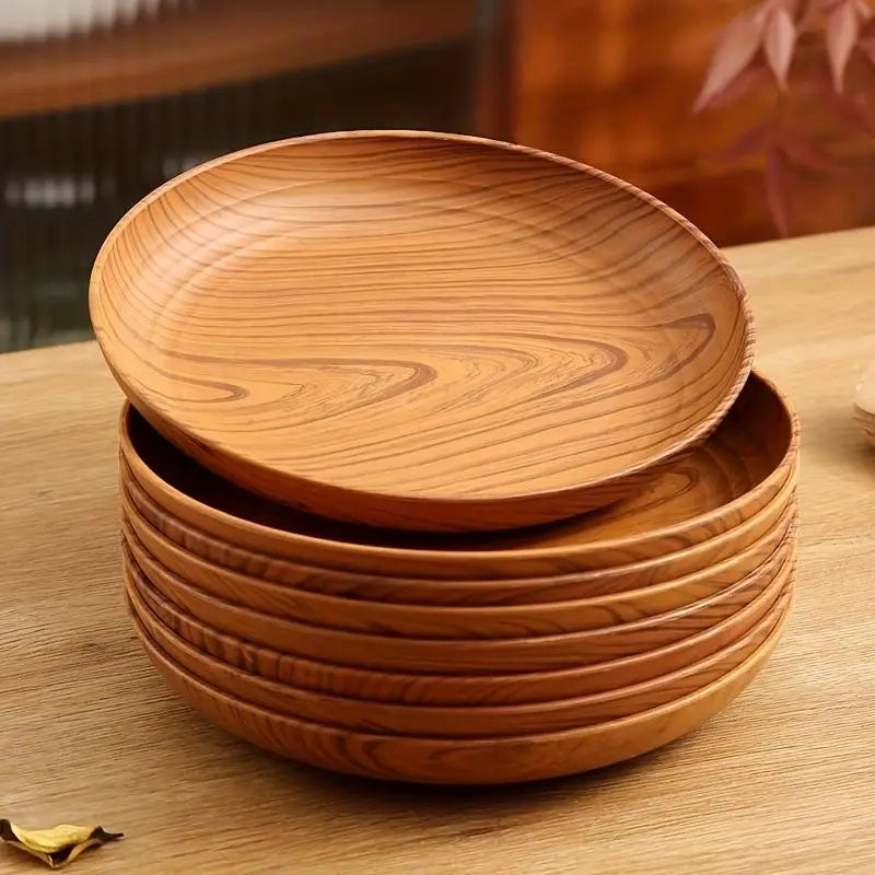 Stack of warm-toned wood grain plastic plates with natural striped design in a 10 piece round set.