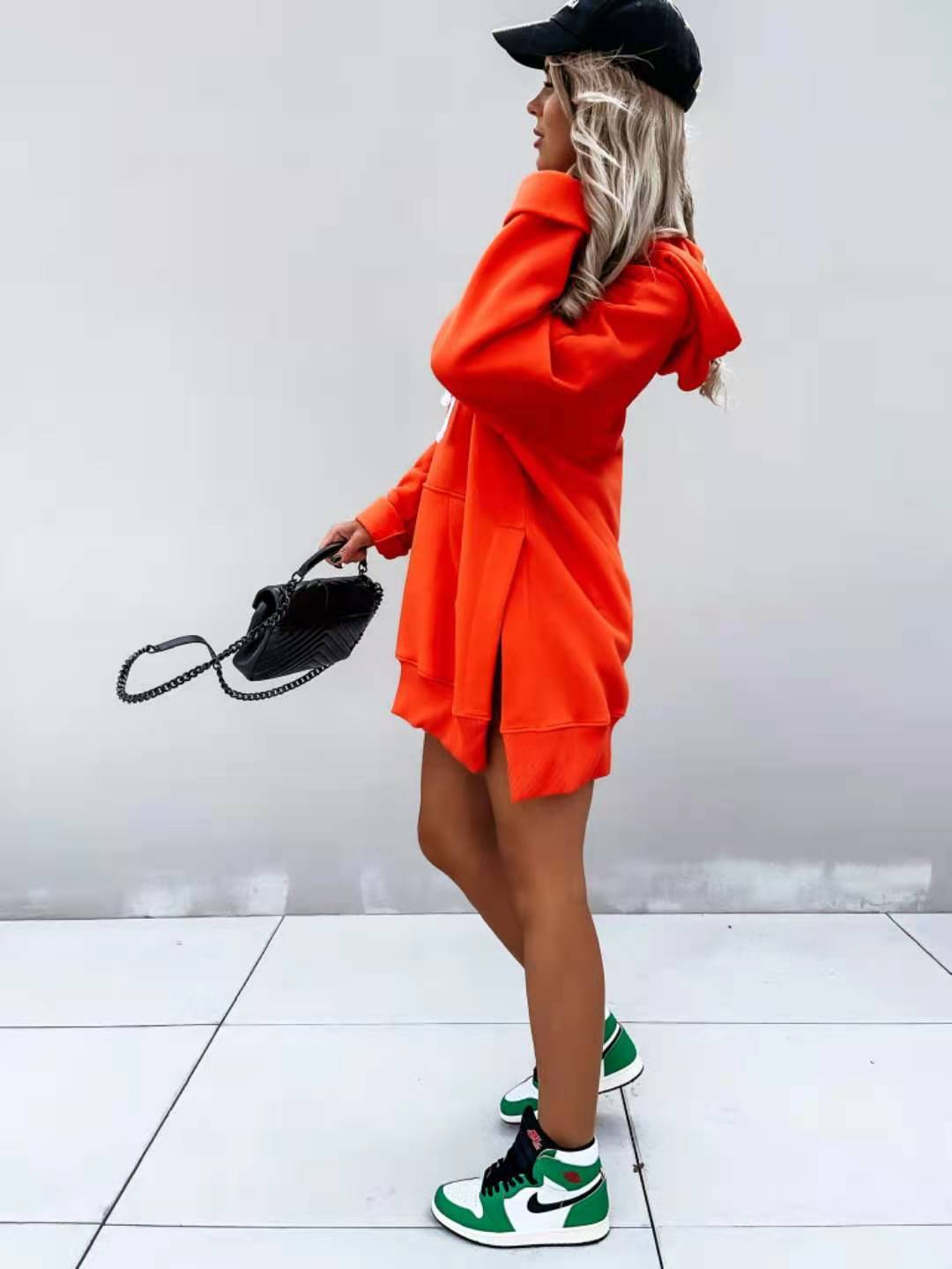 orange oversized mid length hooded sweatshirt dress featuring a hood and pockets made from soft fabric for casual wear