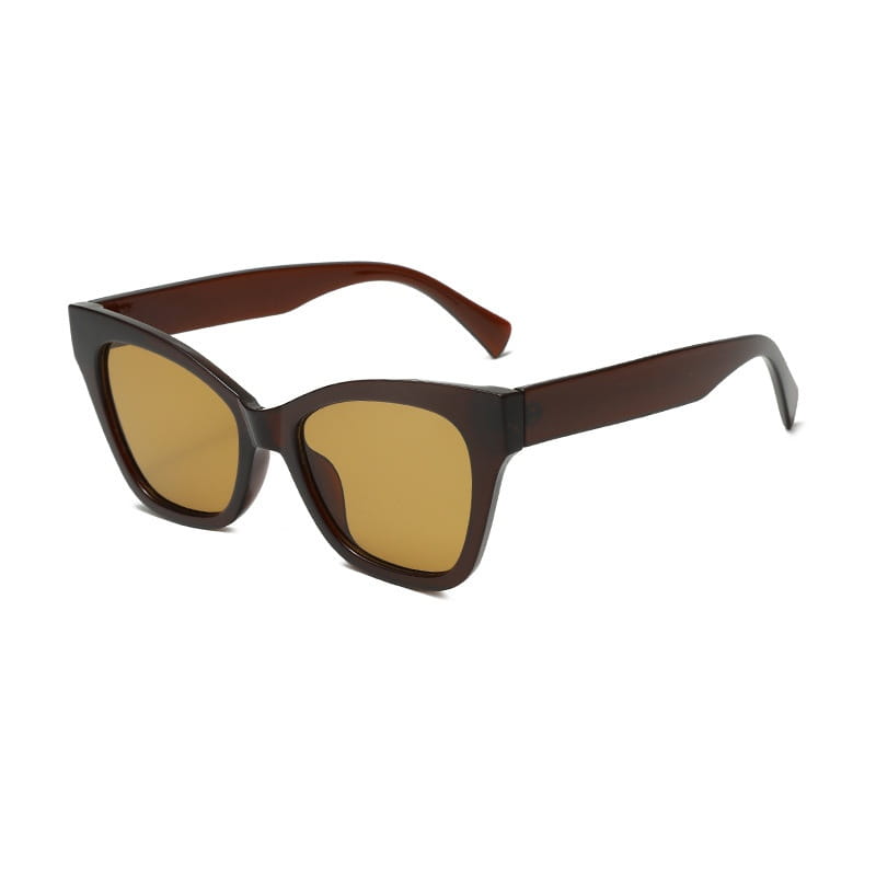 Gafas de sol de moda con forma de ojo de gato color marrón con lentes tintadas ámbar y una montura de plástico lisa y brillante que ofrece protección UV.