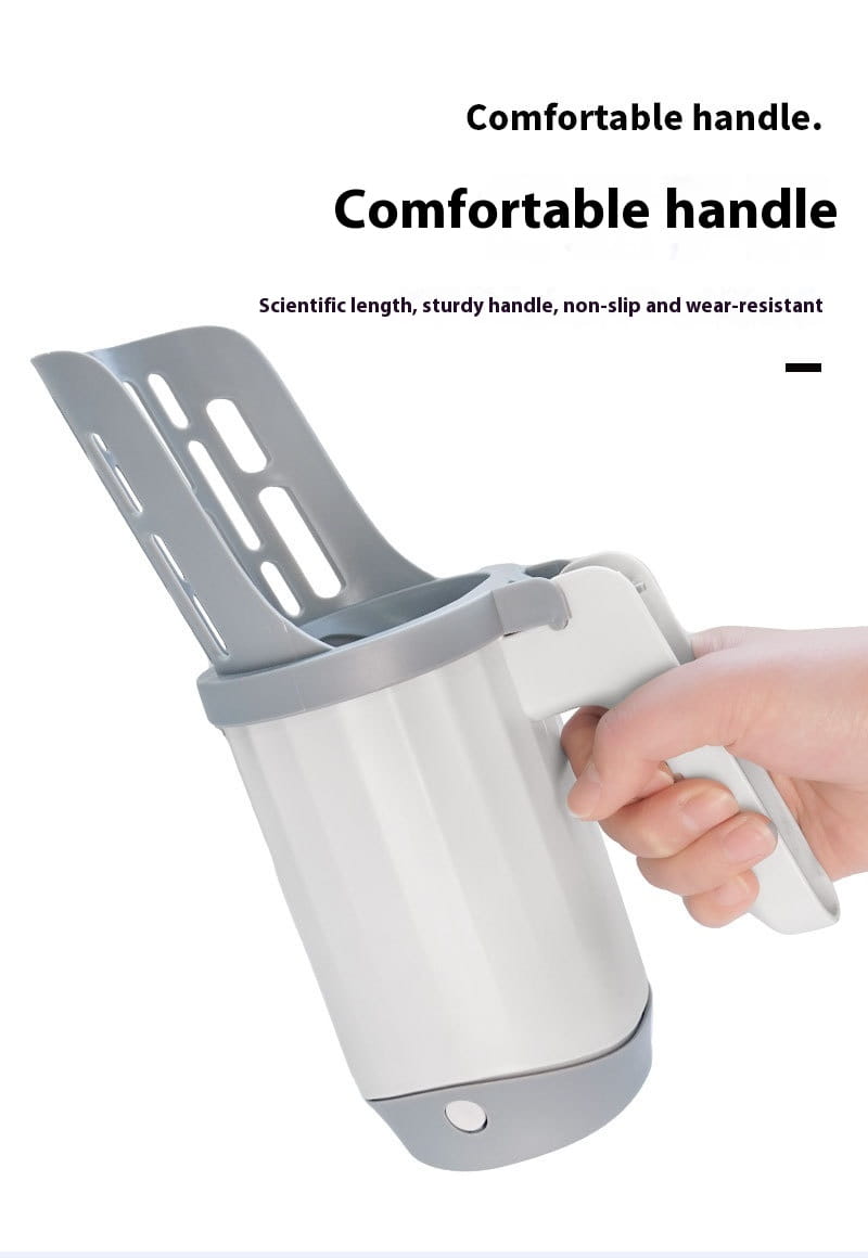 Gray plastic integrated cat litter scoop with a sturdy ergonomic handle and a slotted head for easy scooping and trash disposal.