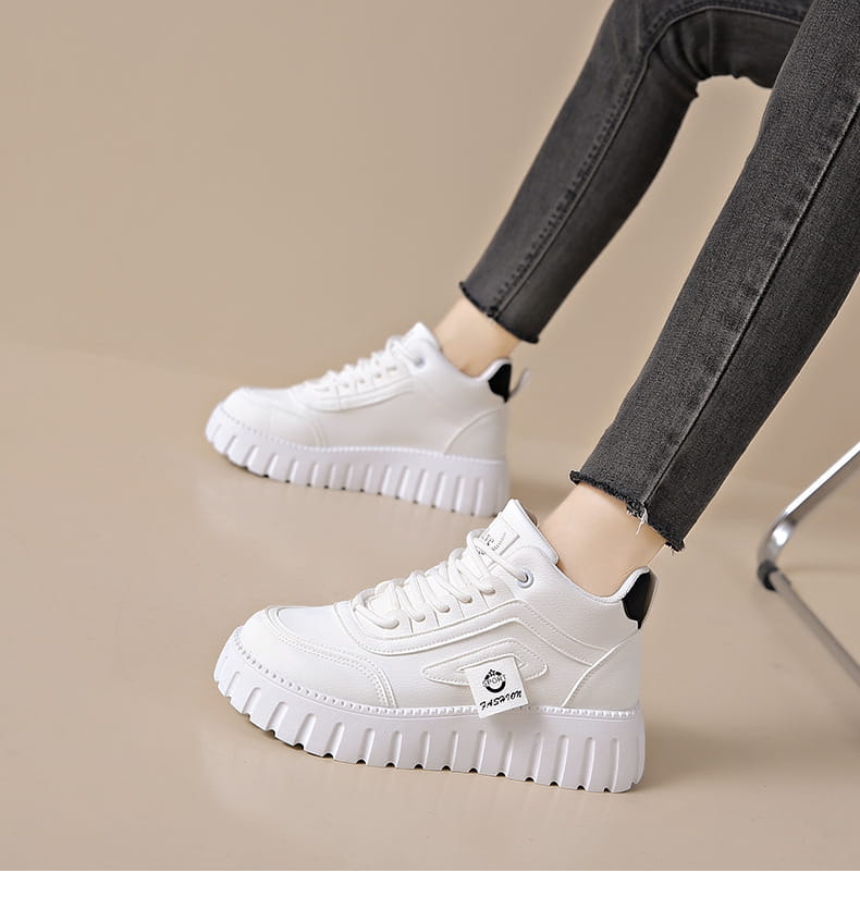 Cream-colored women’s chunky platform breathable high top sneakers with ridged sole and beige suede accents.