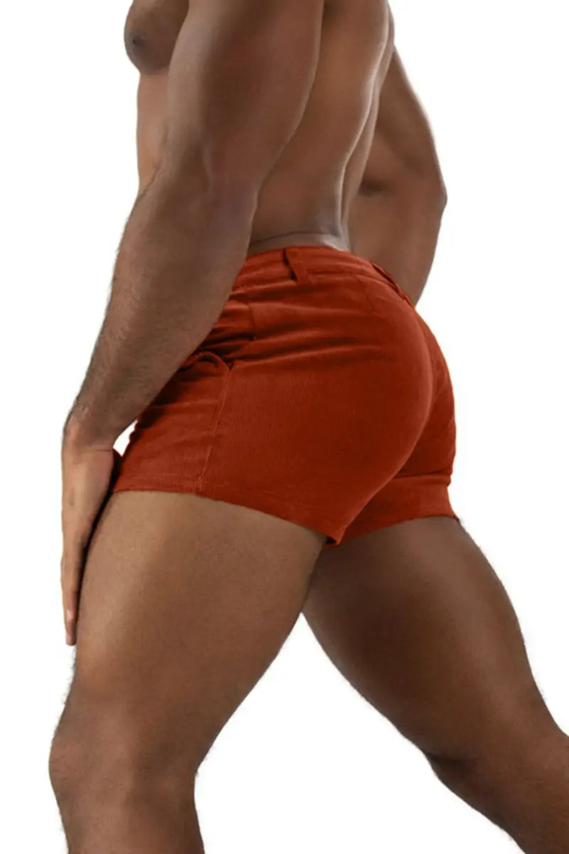 Orange velvet men corduroy beach shorts in a casual mid rise design.