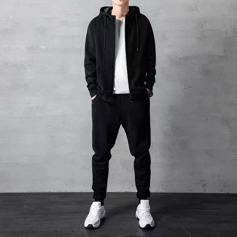 mens zip up hoodie and jogger sweatsuit set featuring a black zip-up hoodie with drawstrings and front pockets paired with matching black joggers.