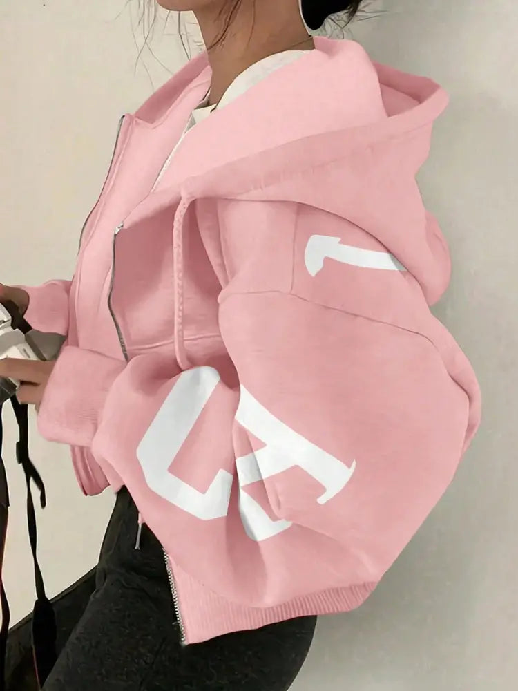 Sweat-shirt à capuche zippé imprimé graphique rose court, avec des lettres blanches audacieuses sur la manche