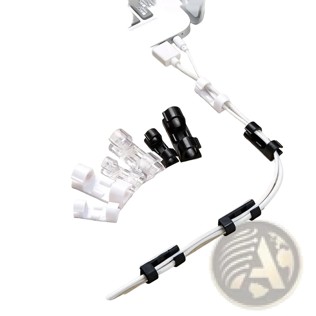 Black and clear plastic cable organizer clips neatly managing white usb cables on desk beside laptop for cord management
