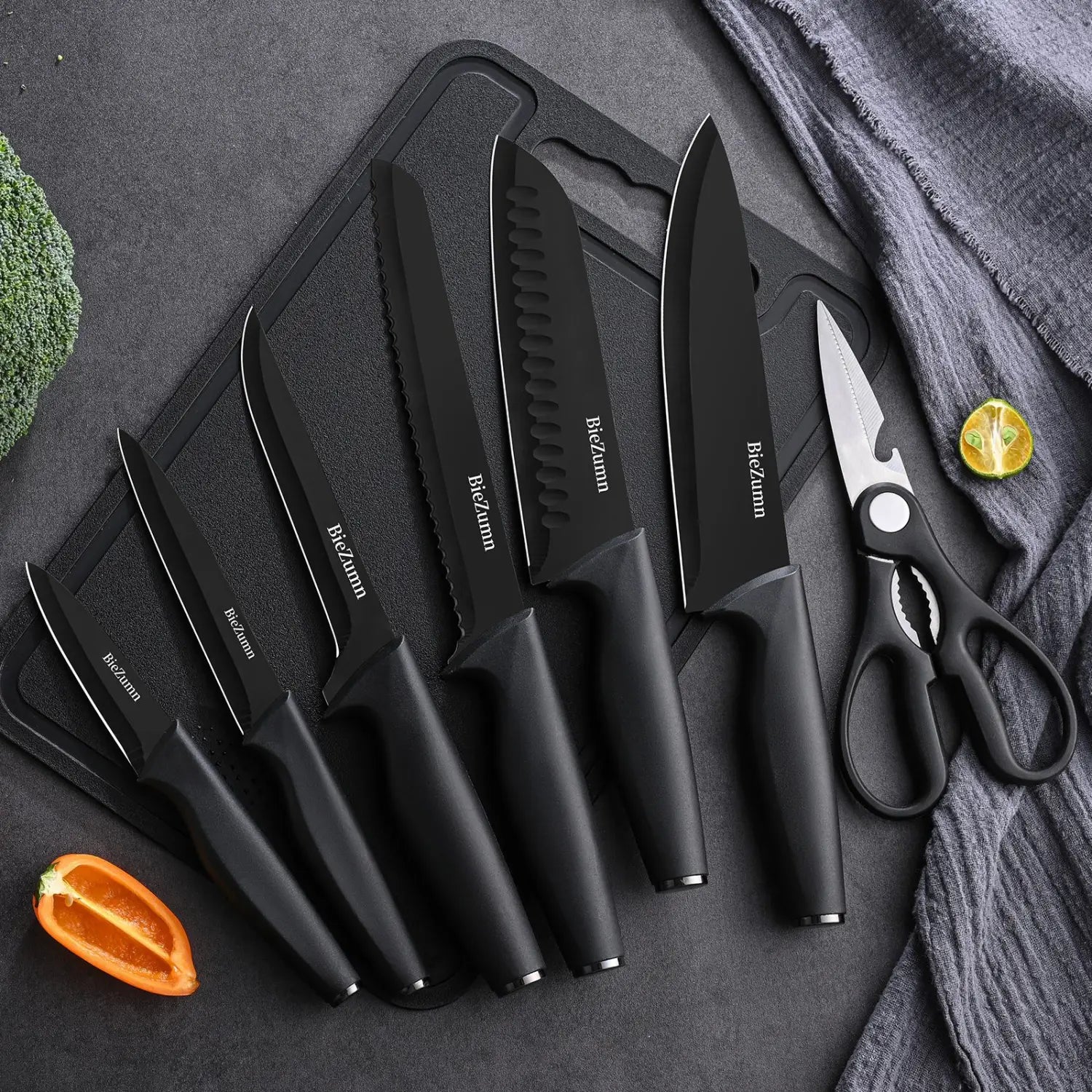 black biczimm stainless steel knife set 15 piece chef block set featuring matte-finished blades and ergonomic handles displayed on a cutting board alongside scissors