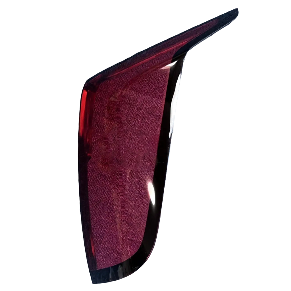 Back side of a glossy deep red cadillac ct6 rear taillight cover 2019-2022 with sleek angular design and black trim