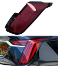 Red and black glossy plastic rear taillight cover for Cadillac Ct6 models 2019-2022 showing back side view