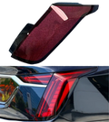 Red and black glossy plastic rear taillight cover for Cadillac Ct6 models 2019-2022 showing back side view