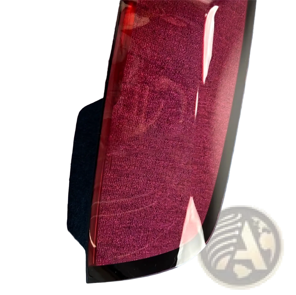 Cadillac CT6 rear taillight cover 2019-2022 with a sleek curved red-tinted plastic exterior and textured interior lining