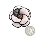 Camellia fabric flower brooch with cream textured petals black lace accents and gold-toned embellished center for women
