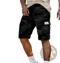 Black camouflage cargo shorts for men with loose fit and multi pocket featuring a white label on thigh pocket