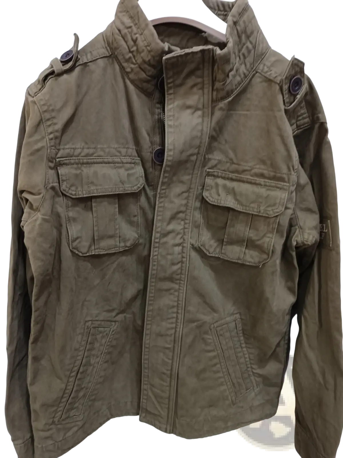 Olive green cotton utility jacket with multiple flap pockets and buttoned epaulets camouflage military style