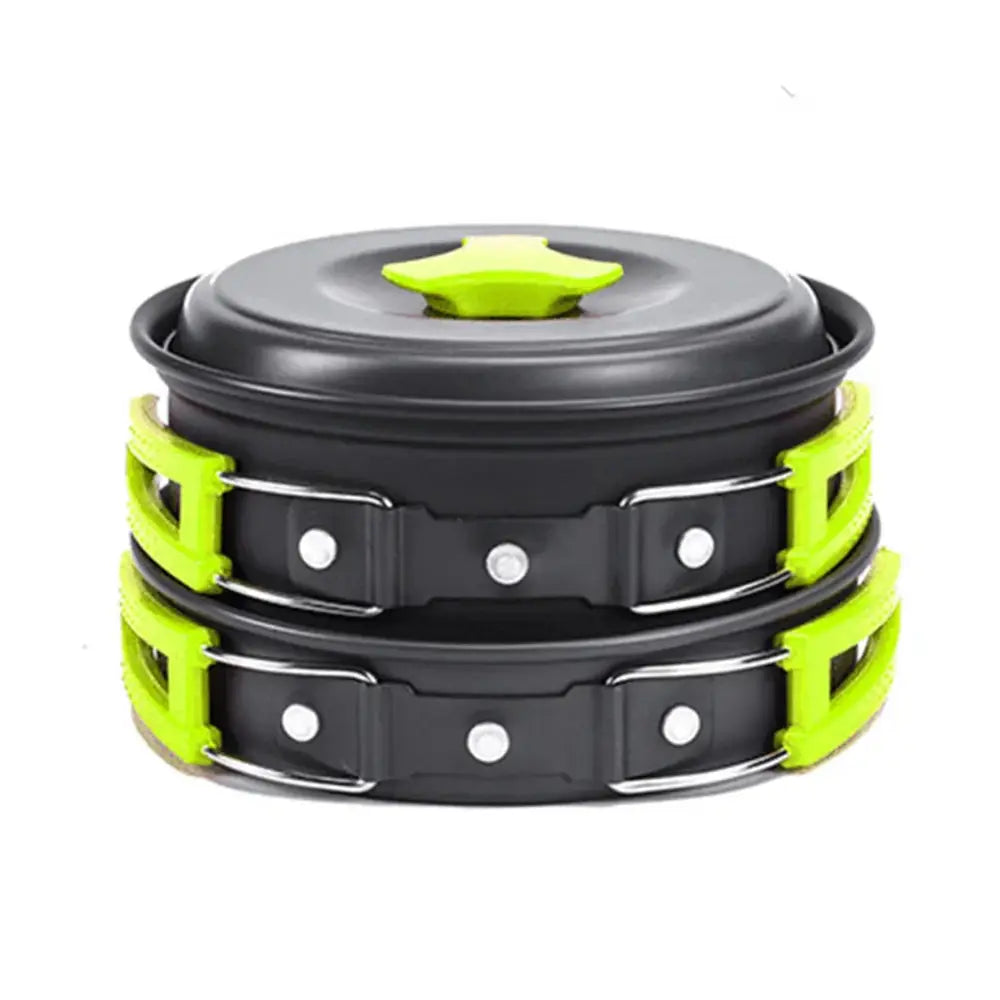 Stacked black and neon green aluminum camping cookware set with star-shaped lid including kettle and utensils