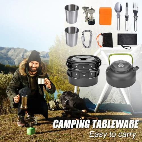 Black stacked aluminum camping pot with green handle and silver carabiner from cookware set with kettle and utensils