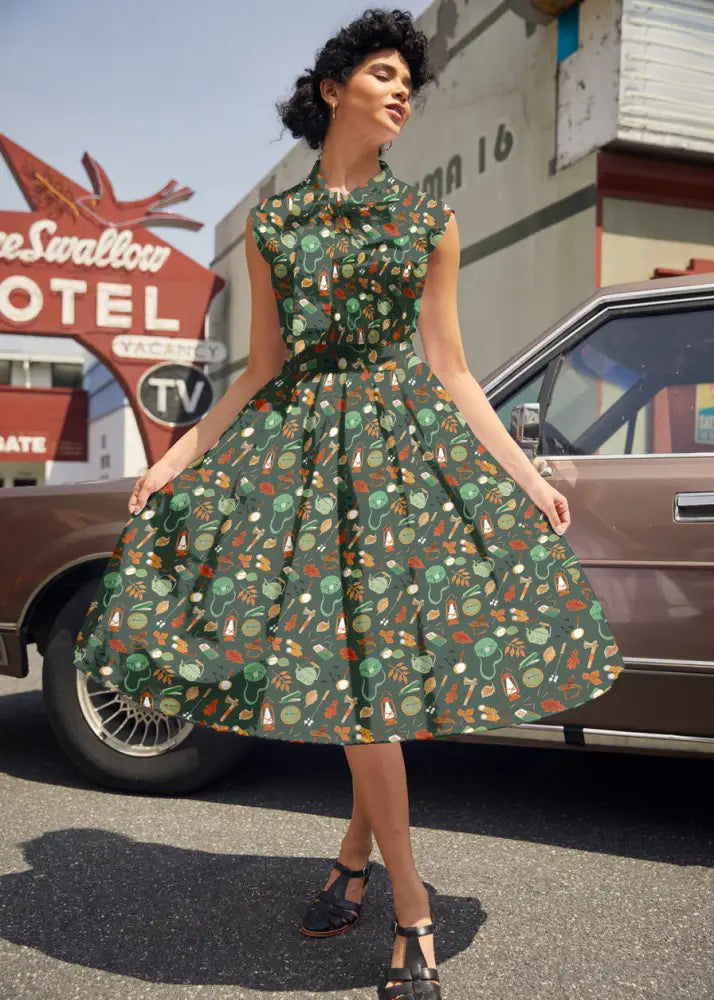Camping Doris retro cotton flared skirt in green with colorful vegetable and fruit pattern featuring fitted bodice and pockets