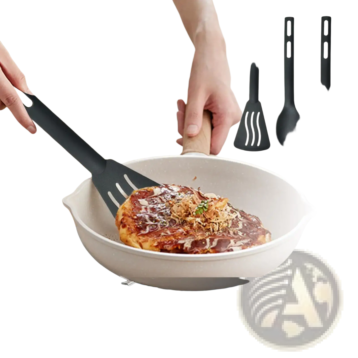 Black anti-scratch nylon spatula with wooden handle flipping a pancake in white pan from camping kitchen utensils set