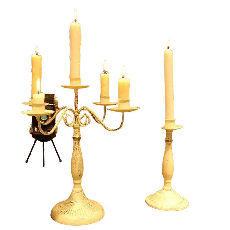 White distressed metal candle holder with ornate curved arms and five lit cream candles for decoration hotel wedding table decorations modern european hotel