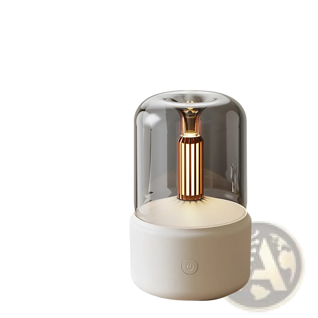 A sleek modern candle light aroma diffuser usb humidifier with translucent gray dome and gold vertical element on white base