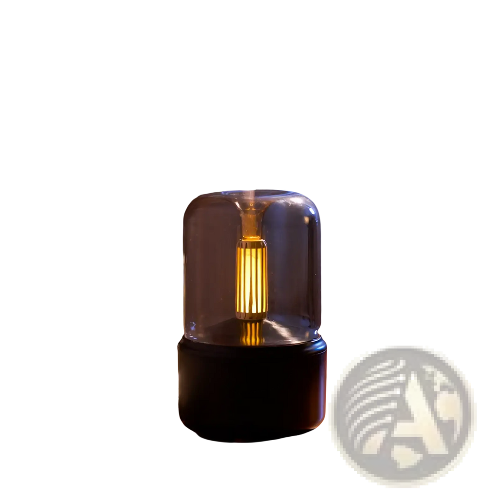 A sleek black and clear glass candlelight aroma diffuser usb mist humidifier with glowing golden interior emits gentle mist