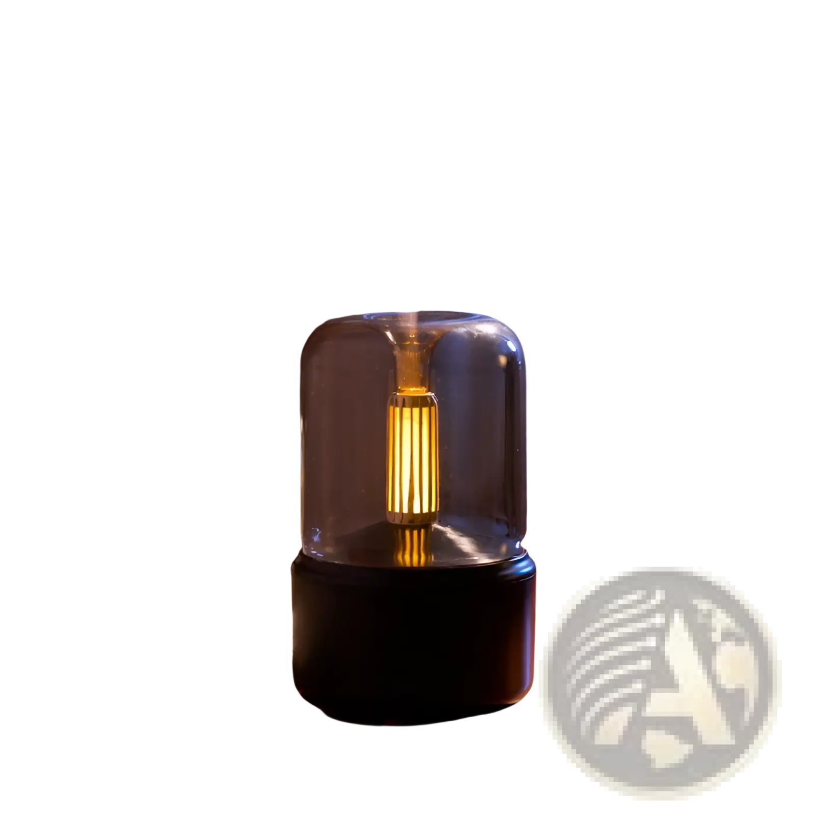 A sleek black and clear glass candlelight aroma diffuser usb mist humidifier with glowing golden interior emits gentle mist
