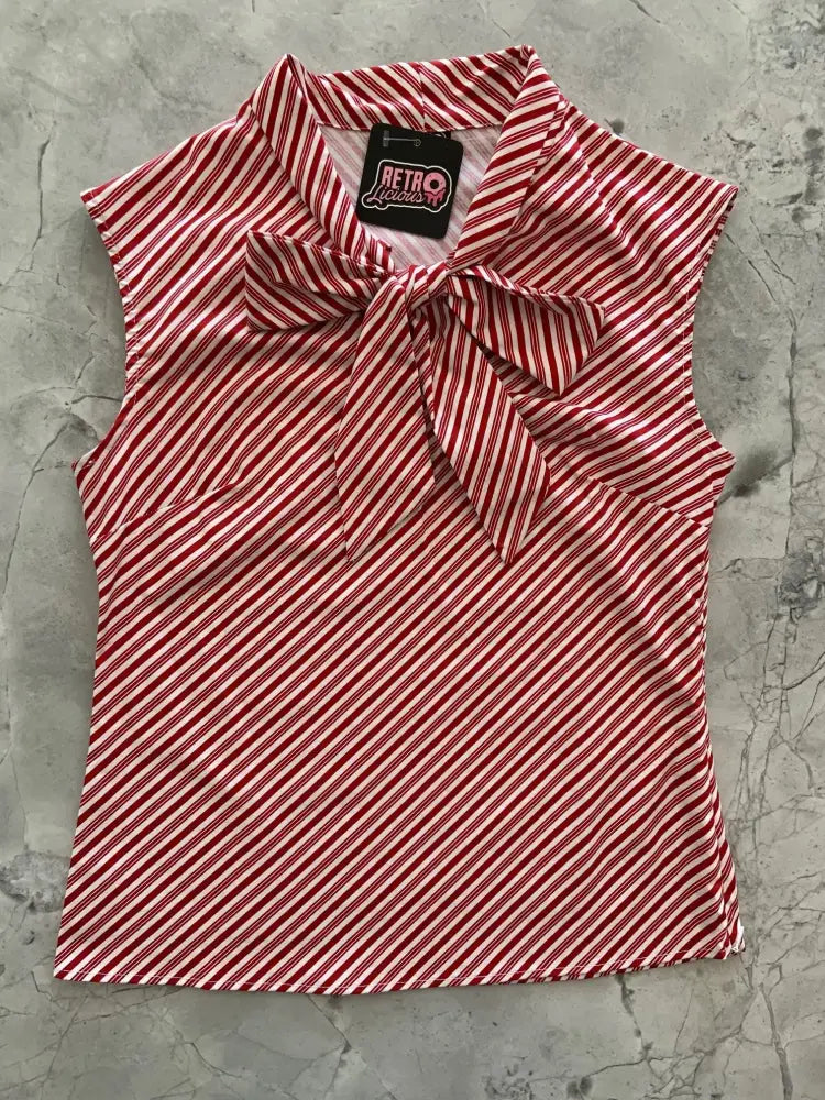 Plus size red and white candy cane stripe sleeveless cotton blouse with a bow neckline in 1950s style
